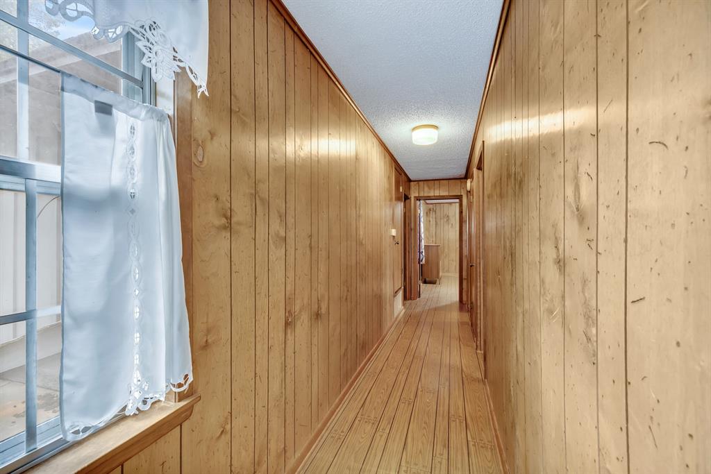 1368 County Road 2206 Rusk, TX 75785 - Photo 18 of 32 a view of a hallway with wooden floor