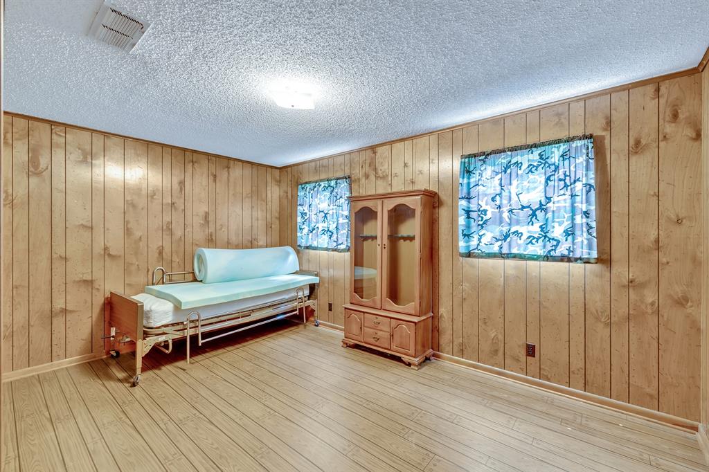 1368 County Road 2206 Rusk, TX 75785 - Photo 21 of 32 a living room with furniture a wooden floor and a window