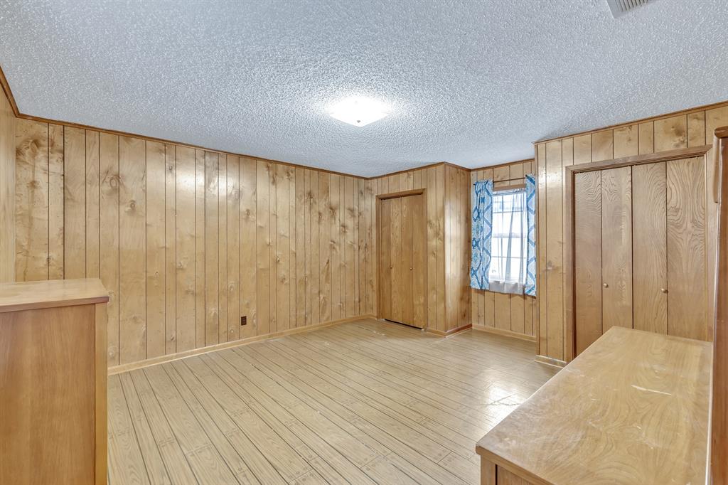 1368 County Road 2206 Rusk, TX 75785 - Photo 22 of 32 a view of an empty room with wooden floor and a window