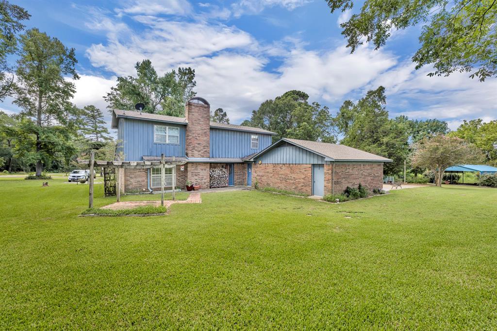 1368 County Road 2206 Rusk, TX 75785 - Photo 25 of 32 a view of a house with a yard and sitting area