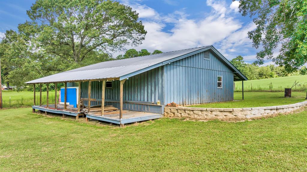 1368 County Road 2206 Rusk, TX 75785 - Photo 28 of 32 a backyard of a house with garden