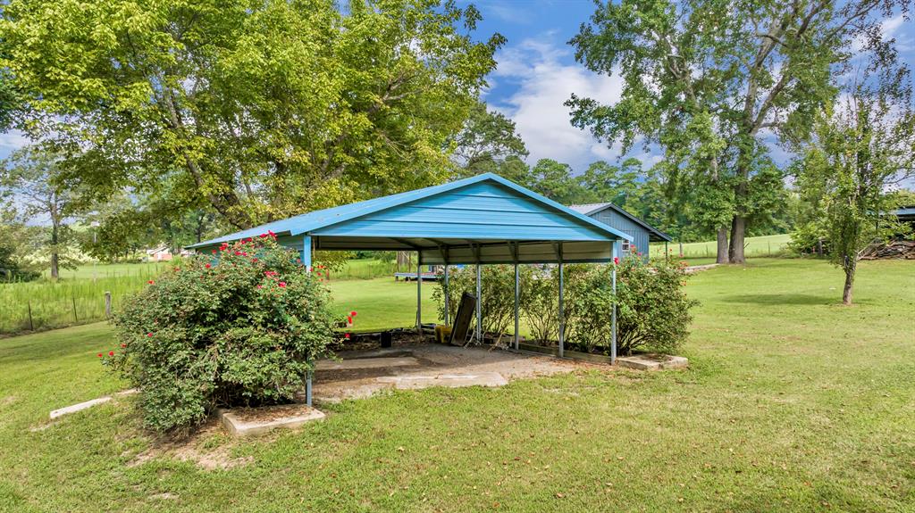 1368 County Road 2206 Rusk, TX 75785 - Photo 30 of 32 a front view of a house with a yard