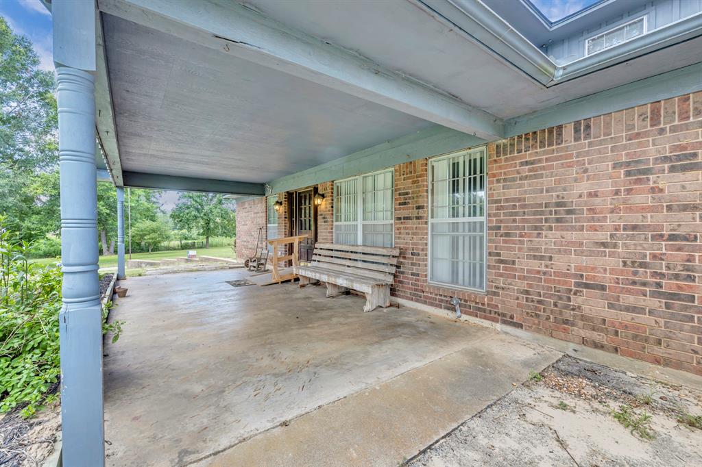 1368 County Road 2206 Rusk, TX 75785 - Photo 3 of 32 a view of an empty room with a window and balcony
