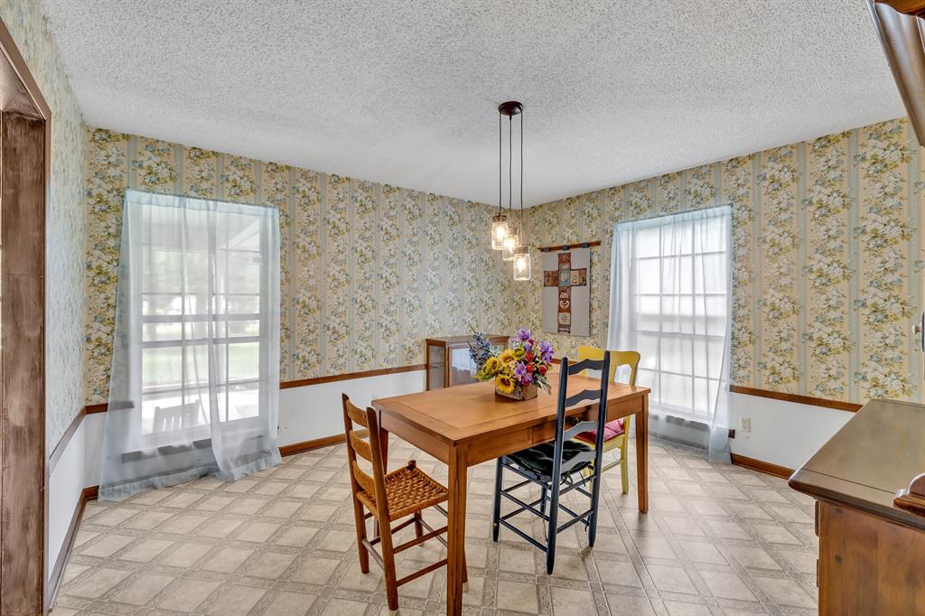 1368 County Road 2206 Rusk, TX 75785 - Photo 8 of 32 a view of a dining room with furniture and chandelier