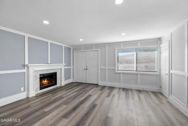 a kitchen with white cabinets stainless steel appliances and sink