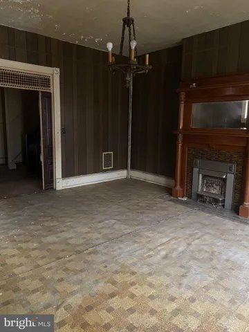a fireplace with a hallway in it