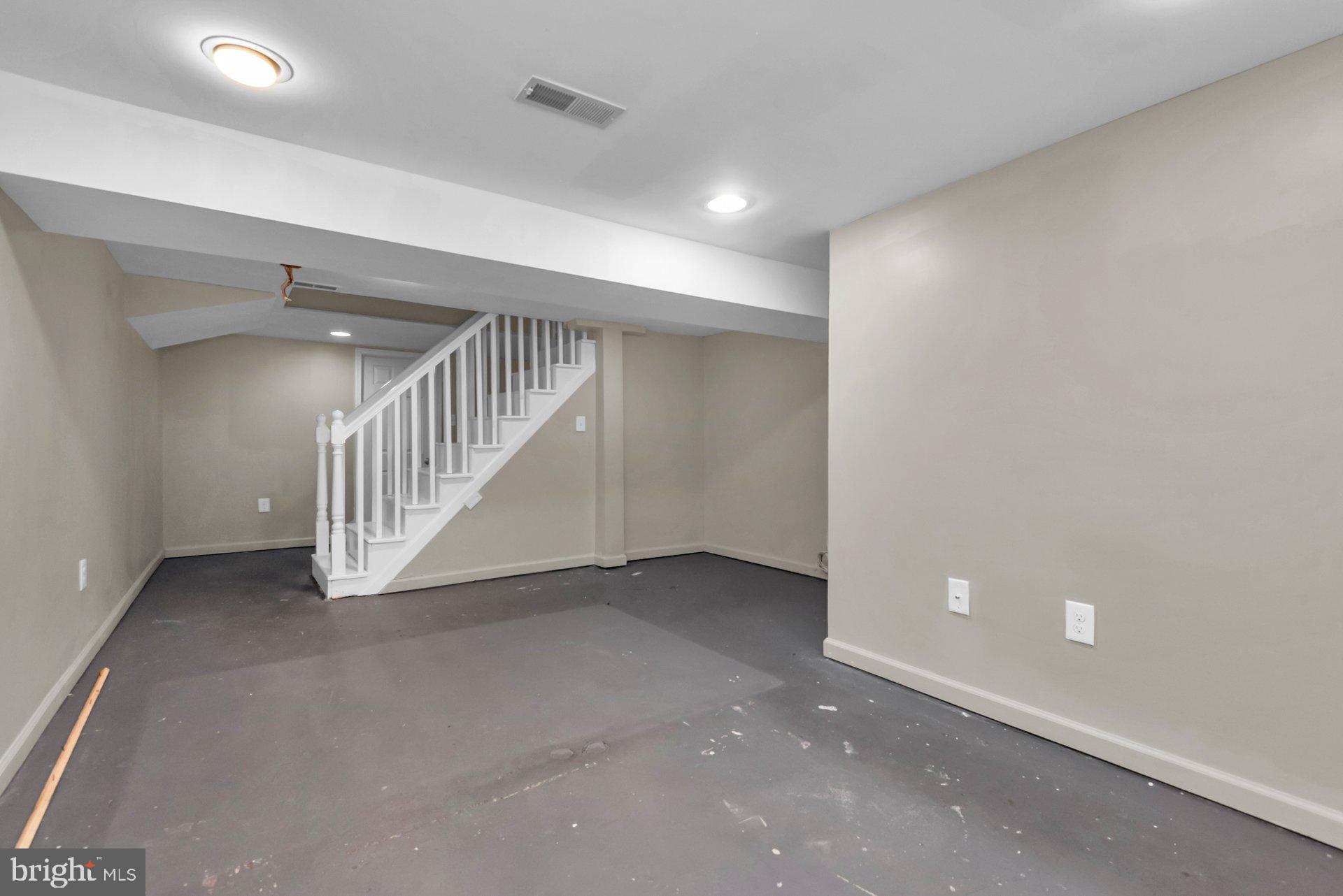 5701 Old Court Road Baltimore, MD 21244 - Photo 33 of 52 Basement Staircase and Open Area