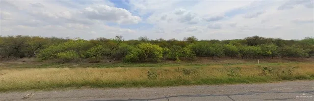 a view of a lake with a yard