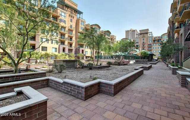 a view of a house with pool and sitting area