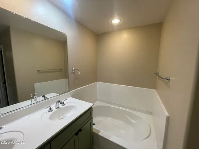 a bathroom with a sink and a bathtub