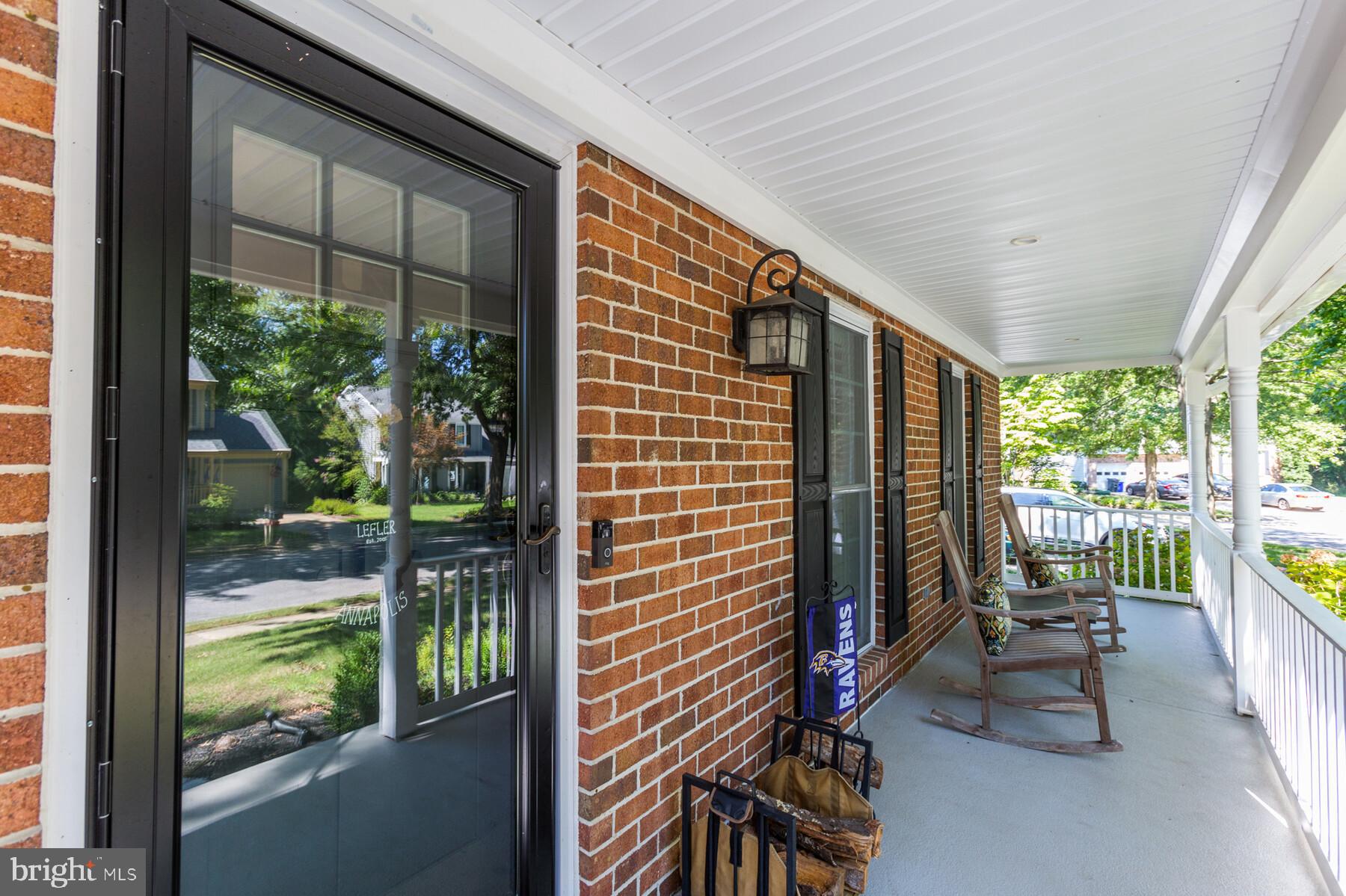 307 Saddle Ridge Road Annapolis, MD 21403 - Photo 2 of 46 a view of porch with a table and chairs