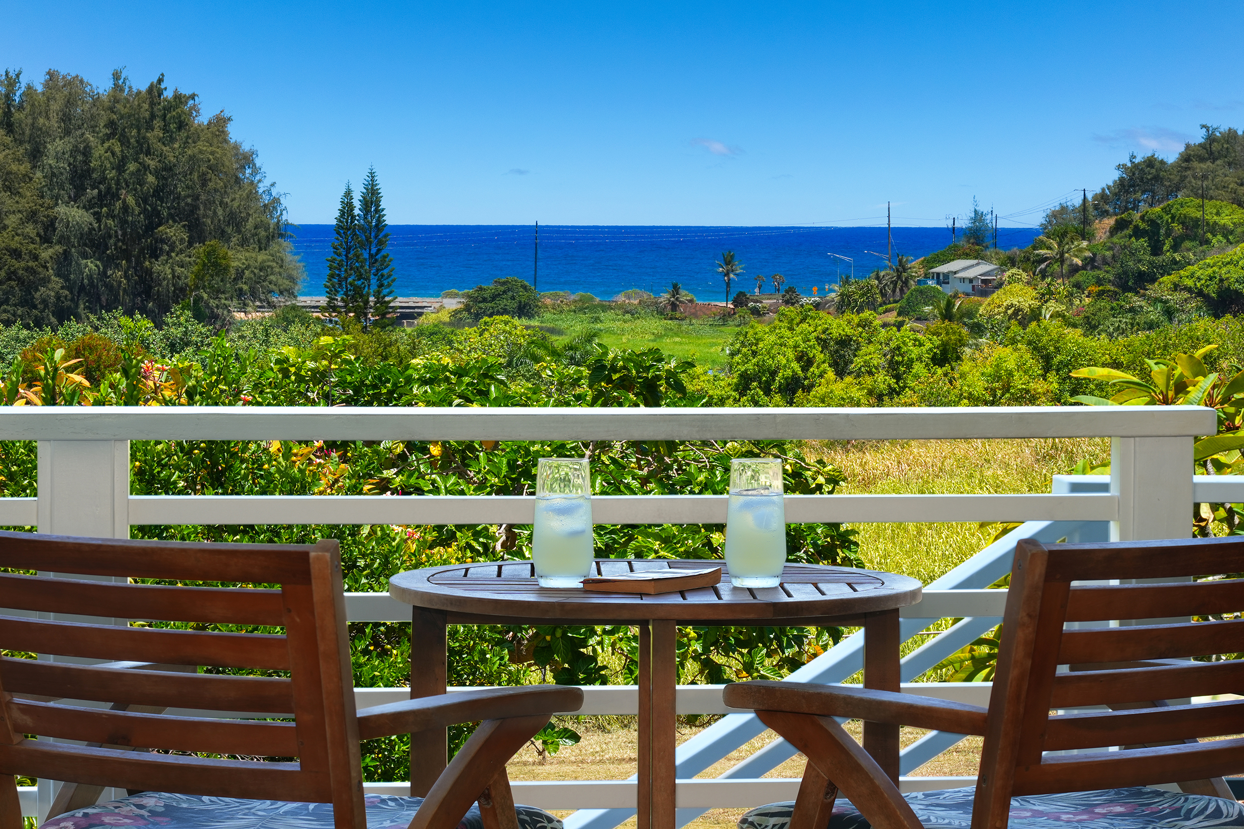 a view of a chairs and table in the balcony