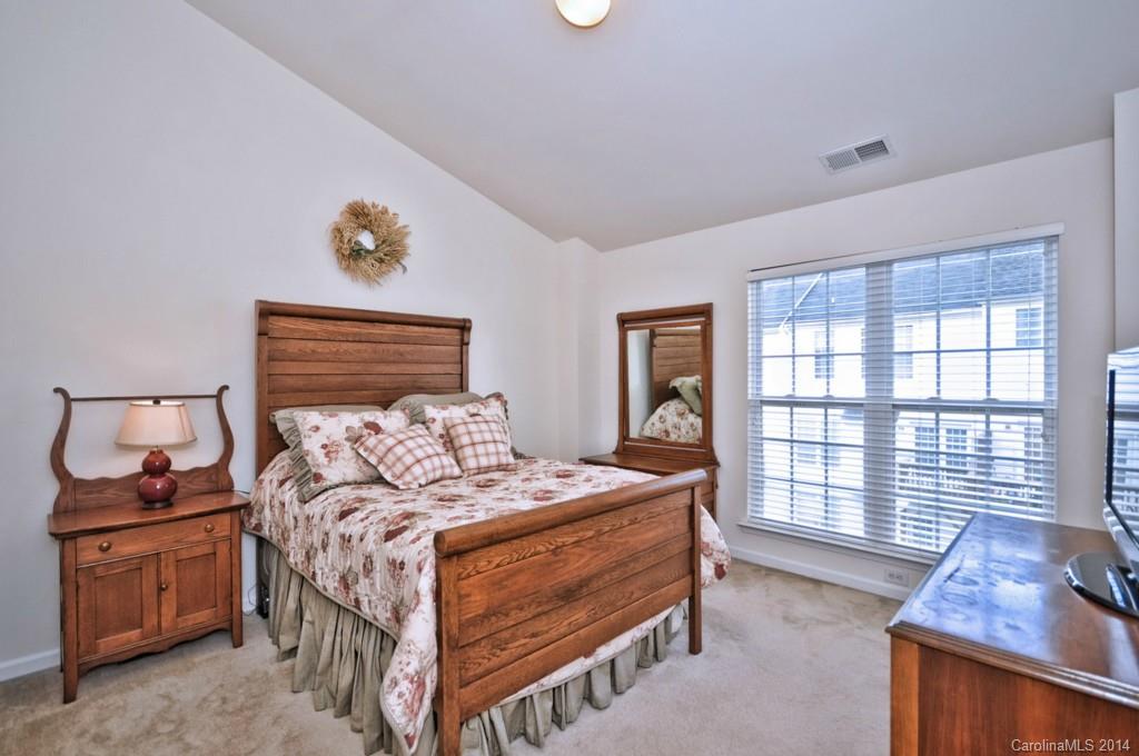 2136 Midnight Blue Lane, Unit 2136 Fort Mill, SC 29708 - Photo 14 of 23 a bedroom with a bed and a window
