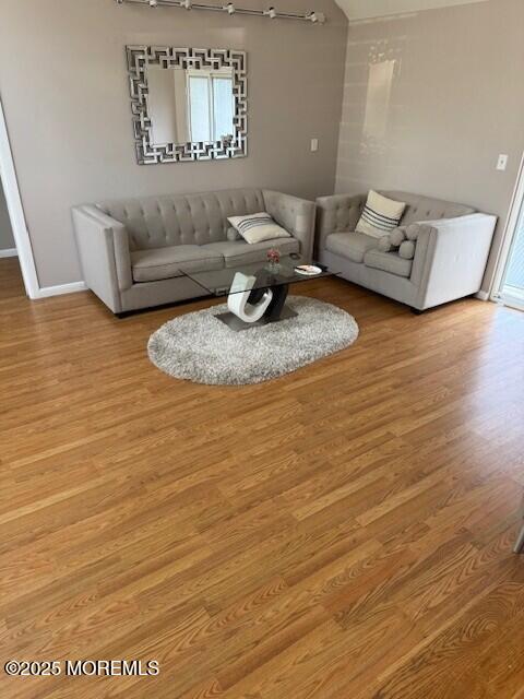 406 Deal Road Asbury Park, NJ 07712 - Photo 3 of 6 a living room with furniture and a wooden floor