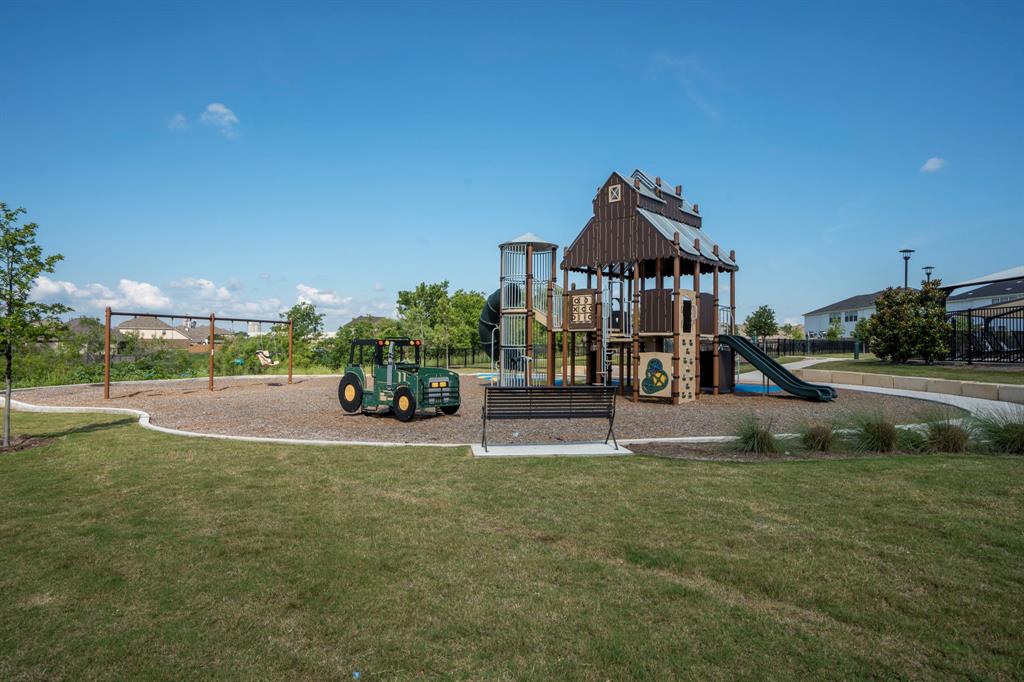 195 C Waterside Road Buda, TX 78610 - Photo 25 of 27 Community play area featuring a lawn