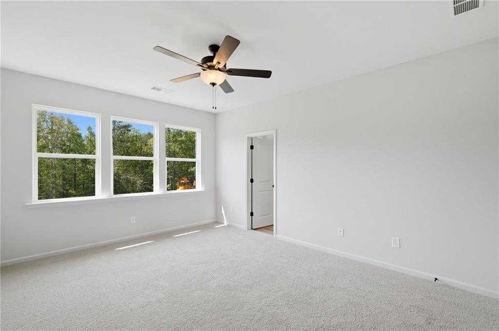 299 Summit View Lane, Unit 5 Jasper, GA 30143 - Photo 22 of 43 a view of a livingroom with a ceiling fan and window