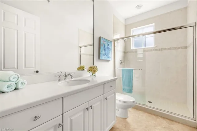 a front view of a house with a garden and plants