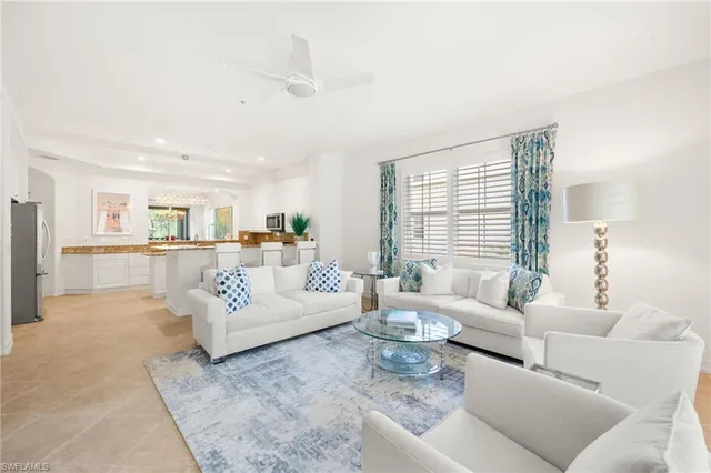 a living room with furniture and windows