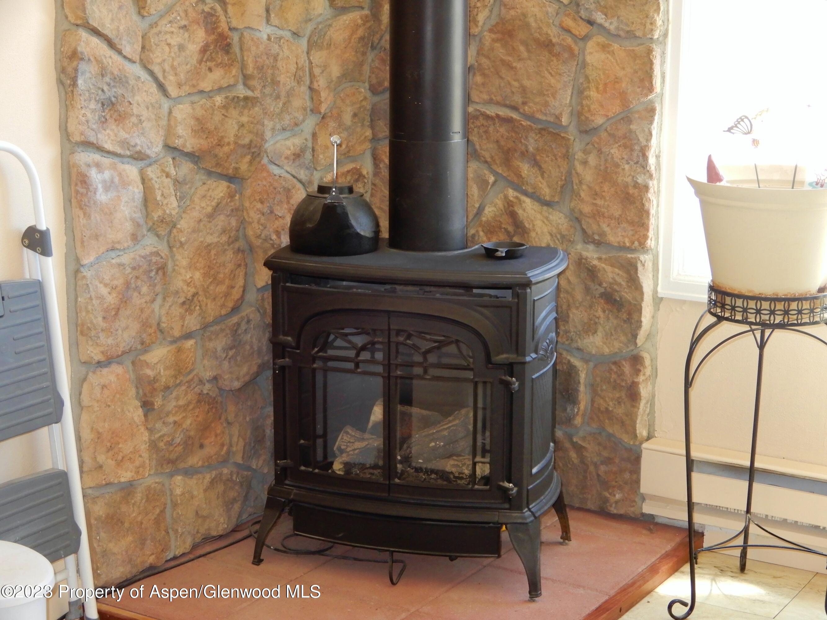 129 East 11th Street Rifle, CO 81650 - Photo 17 of 24 a living room with a fireplace