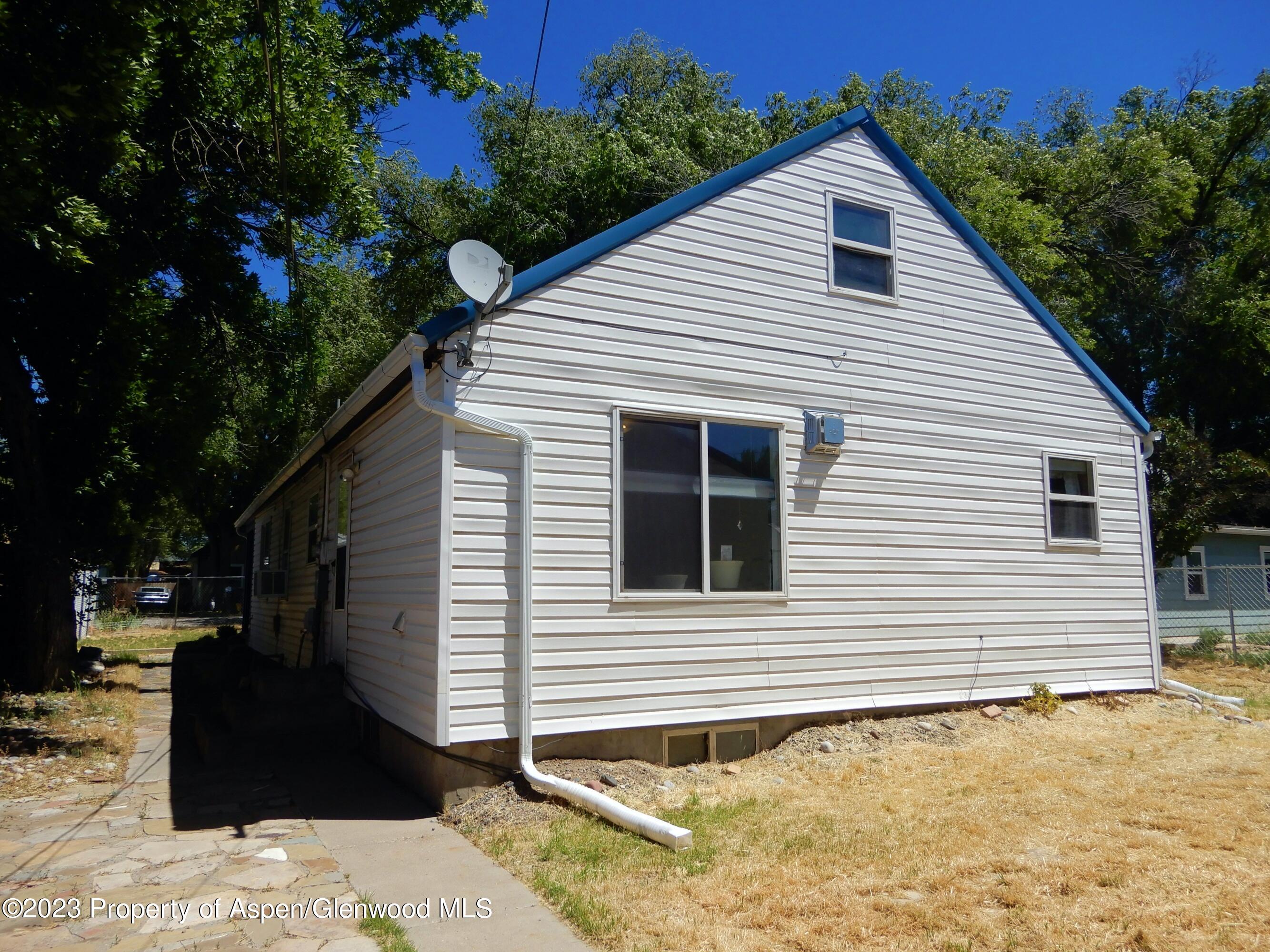 129 East 11th Street Rifle, CO 81650 - Photo 24 of 24 a view of a house with a yard