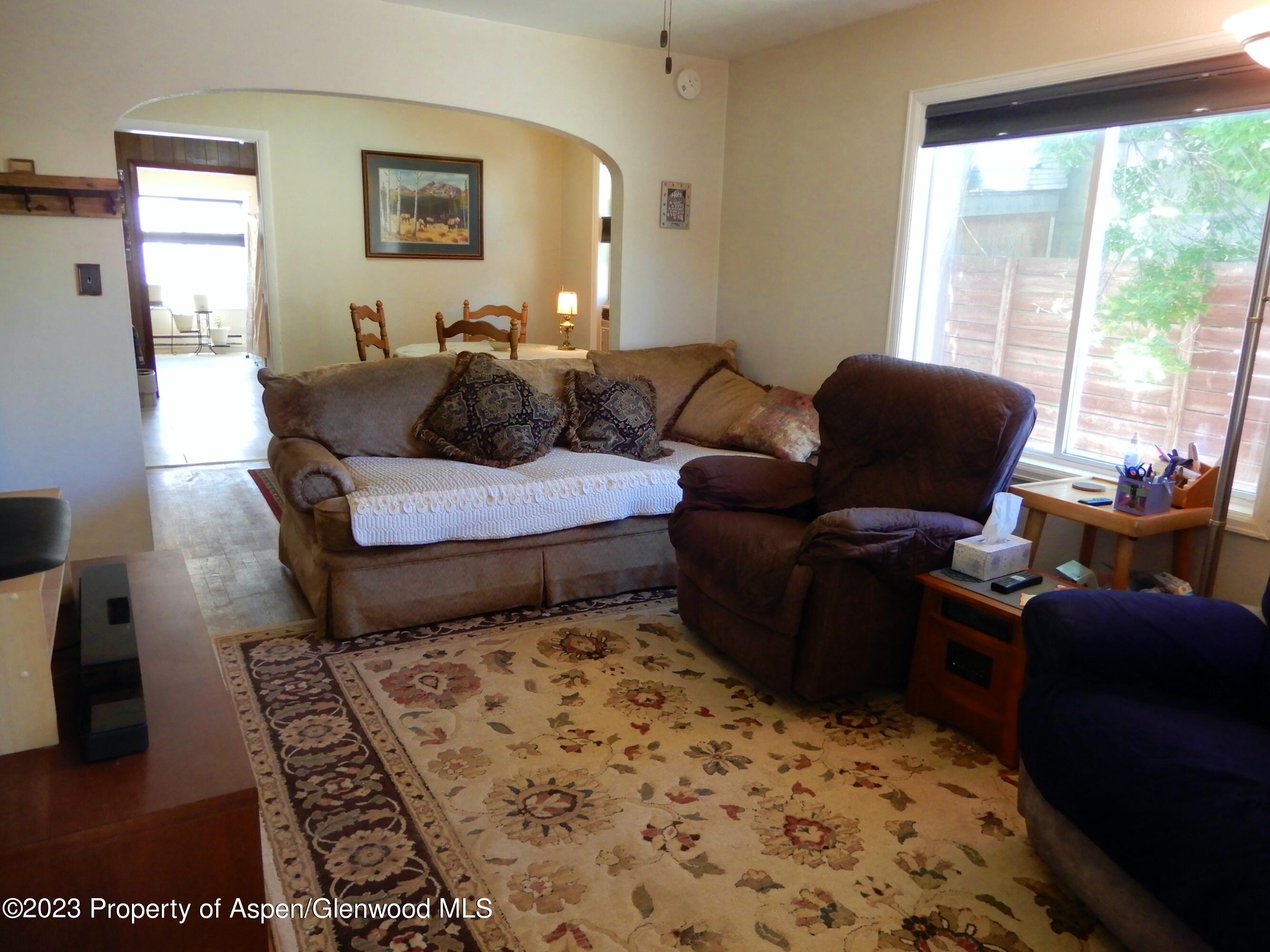 129 East 11th Street Rifle, CO 81650 - Photo 6 of 24 a living room with furniture and a window