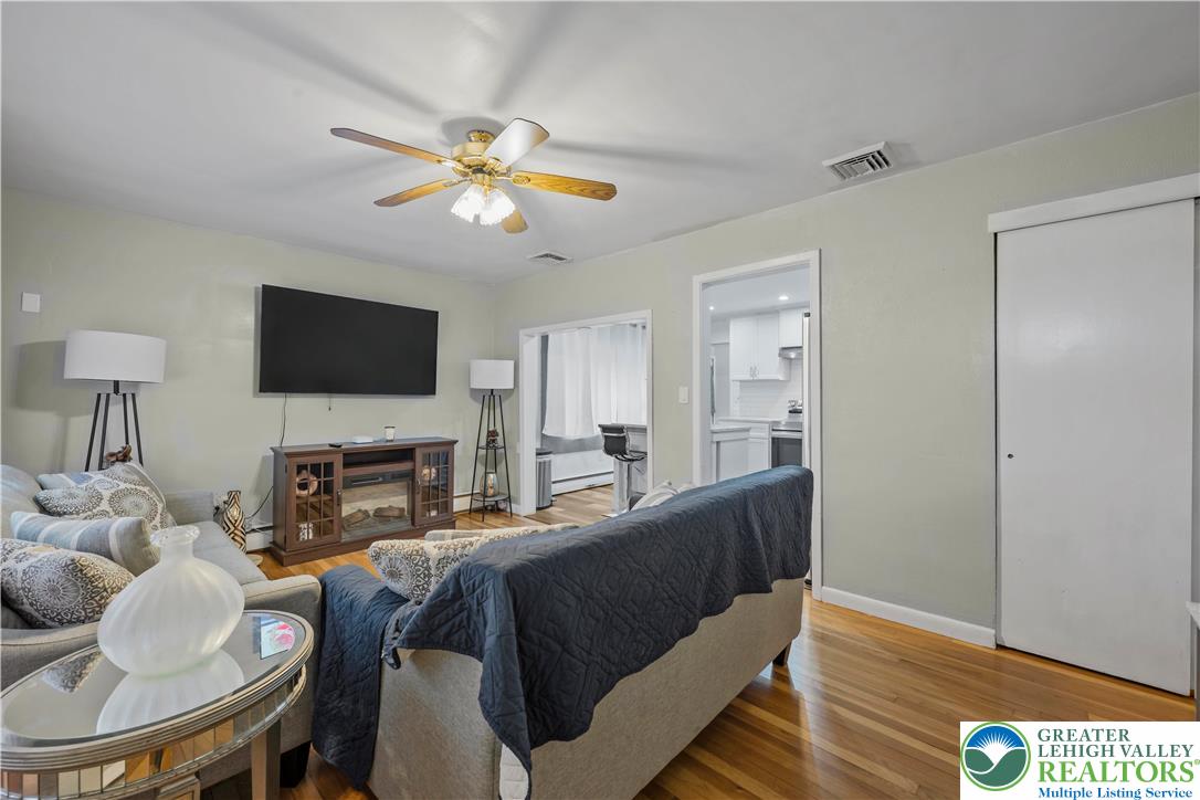 148 North 8th Street Coplay, PA 18037 - Photo 13 of 45 a living room with furniture and a flat screen tv