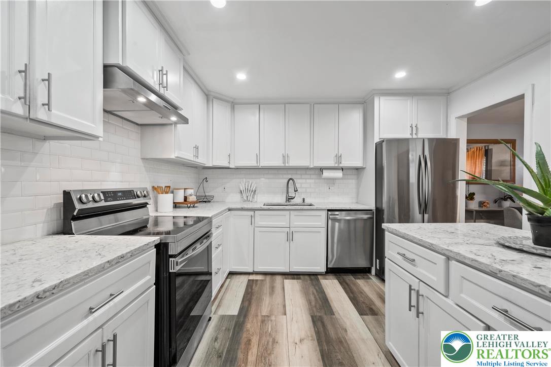 148 North 8th Street Coplay, PA 18037 - Photo 20 of 45 a kitchen with a sink stove and refrigerator