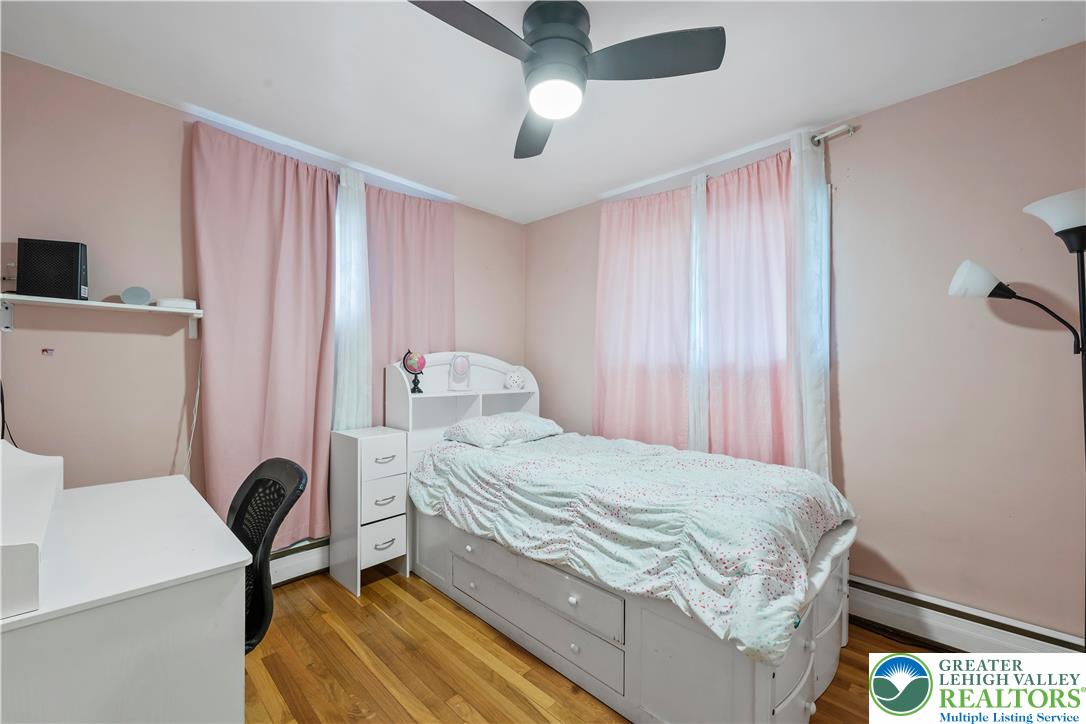 148 North 8th Street Coplay, PA 18037 - Photo 25 of 45 a bedroom with a bed and a table in it