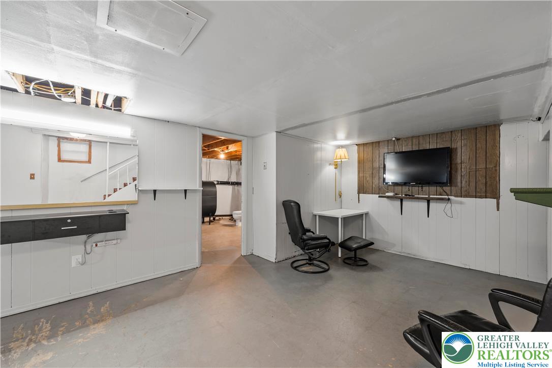 148 North 8th Street Coplay, PA 18037 - Photo 30 of 45 a living room with furniture and a flat screen tv