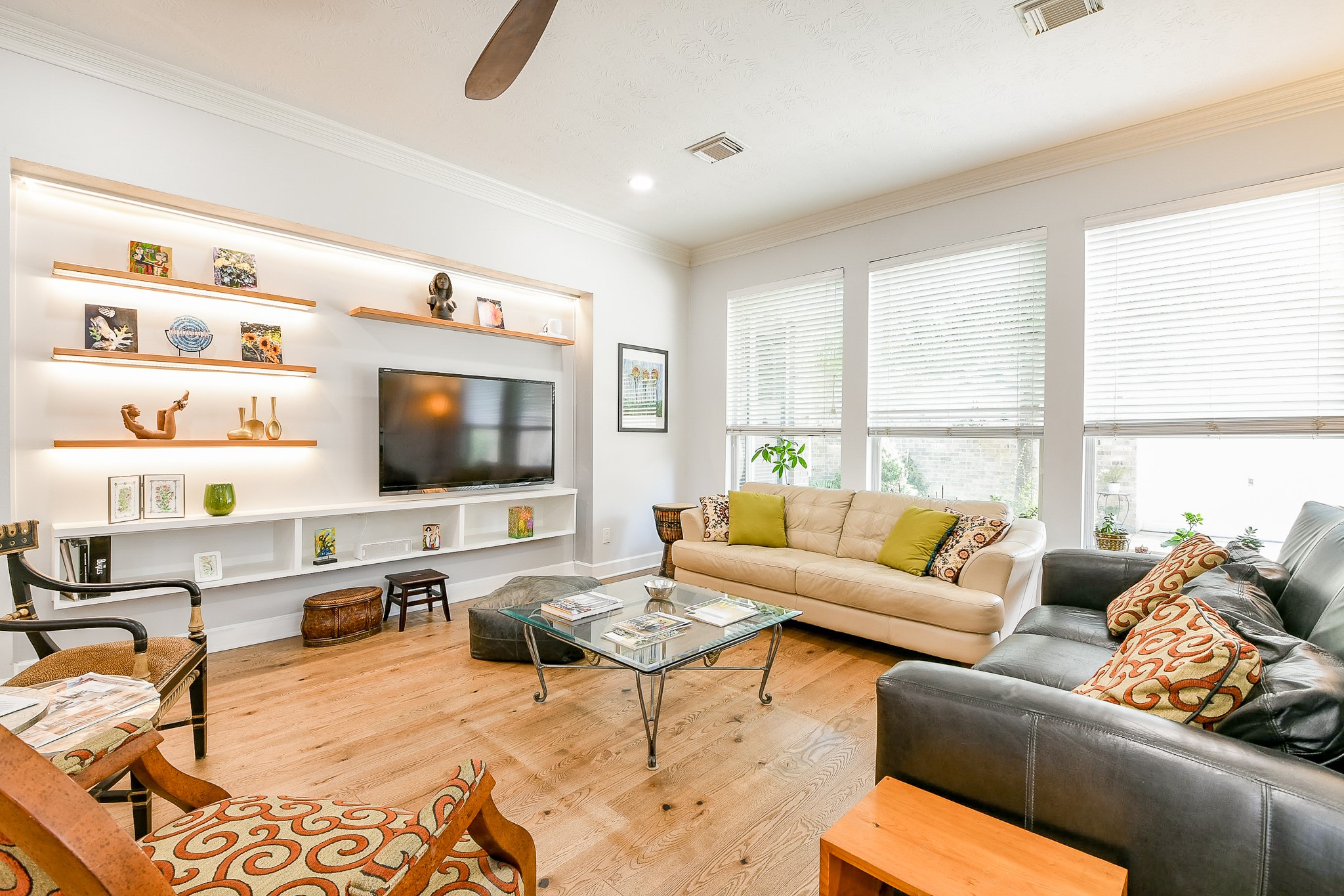 2442 Chimney Rock Road Houston, TX 77057 - Photo 19 of 50 a living room with furniture and a flat screen tv
