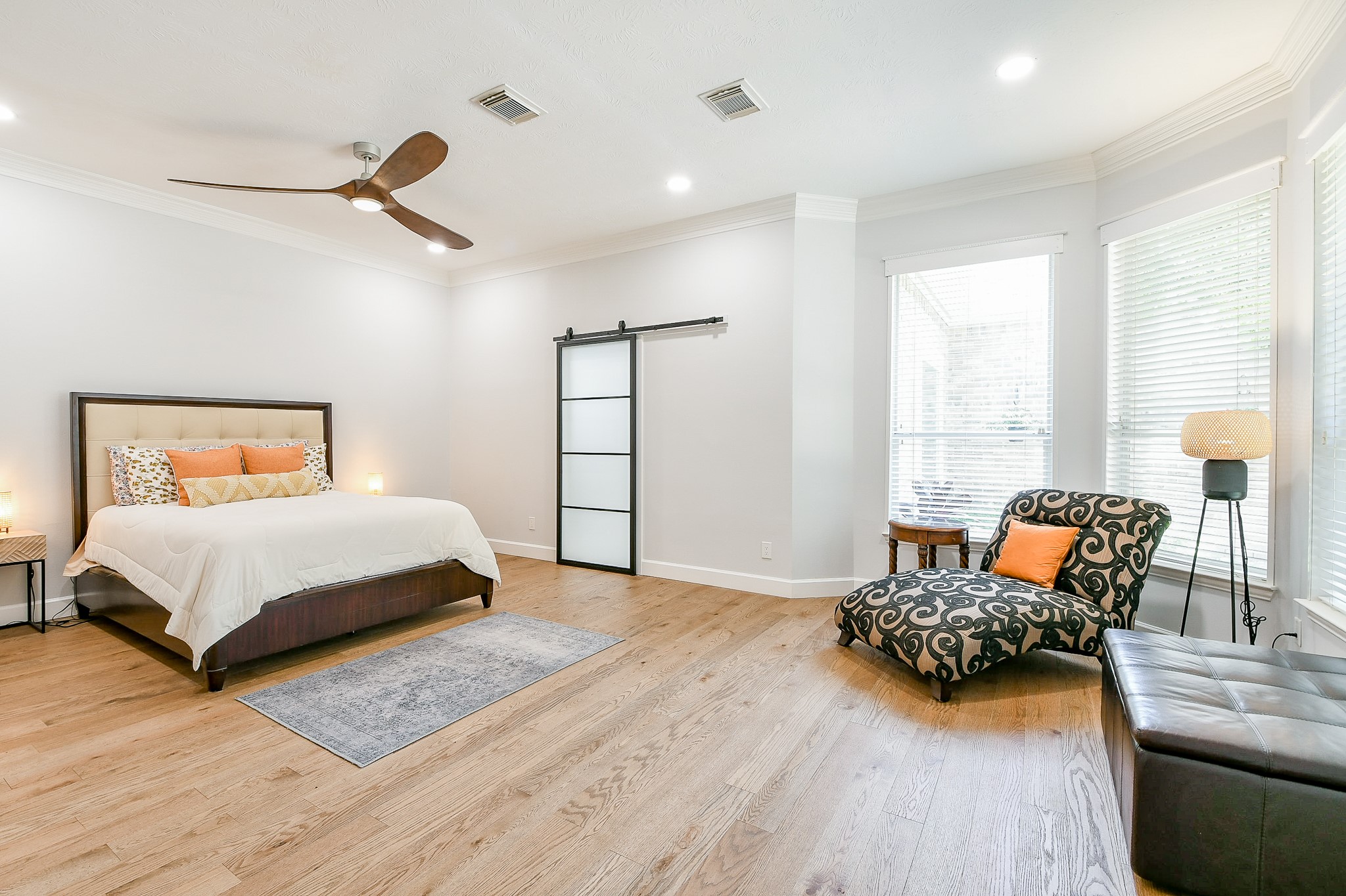 2442 Chimney Rock Road Houston, TX 77057 - Photo 26 of 50 a bedroom with a bed and wooden floor