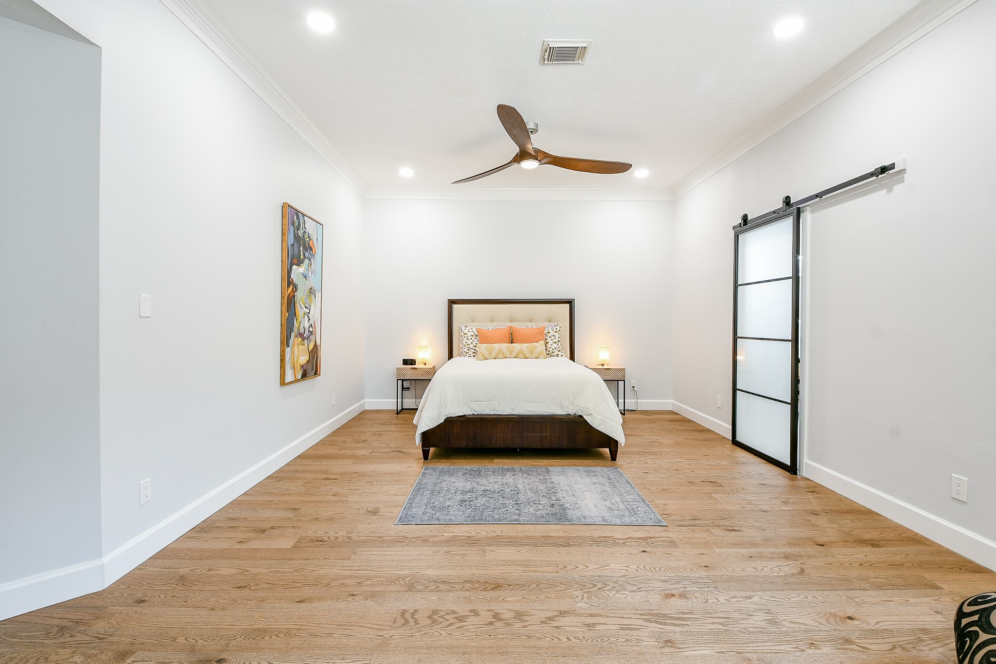 2442 Chimney Rock Road Houston, TX 77057 - Photo 27 of 50 a bedroom with a bed and a window