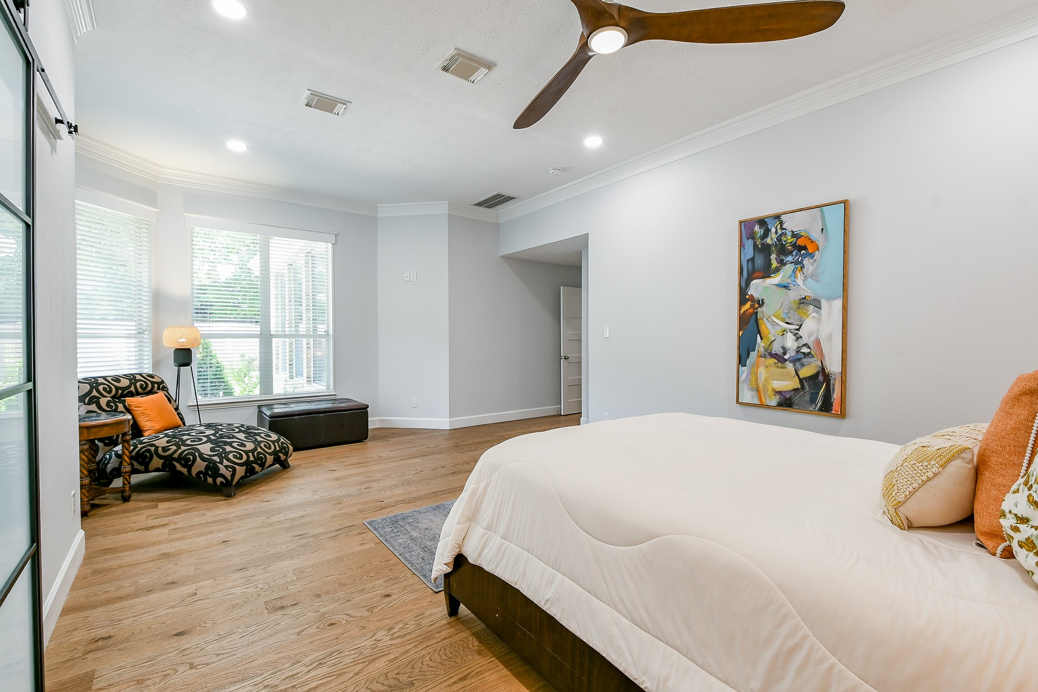 2442 Chimney Rock Road Houston, TX 77057 - Photo 28 of 50 a bedroom with a bed and wooden floor