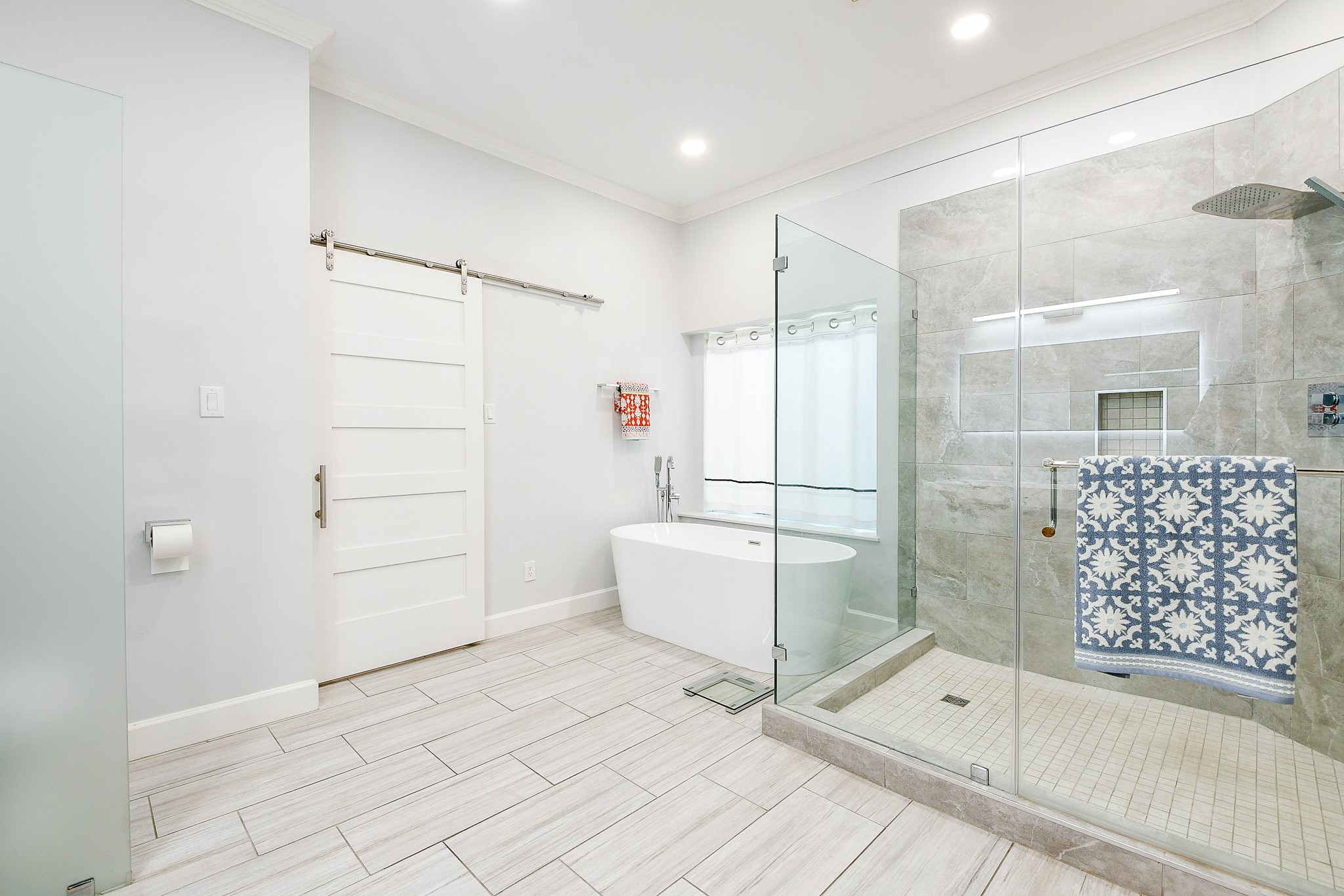 2442 Chimney Rock Road Houston, TX 77057 - Photo 30 of 50 a bathroom with a bathtub and shower