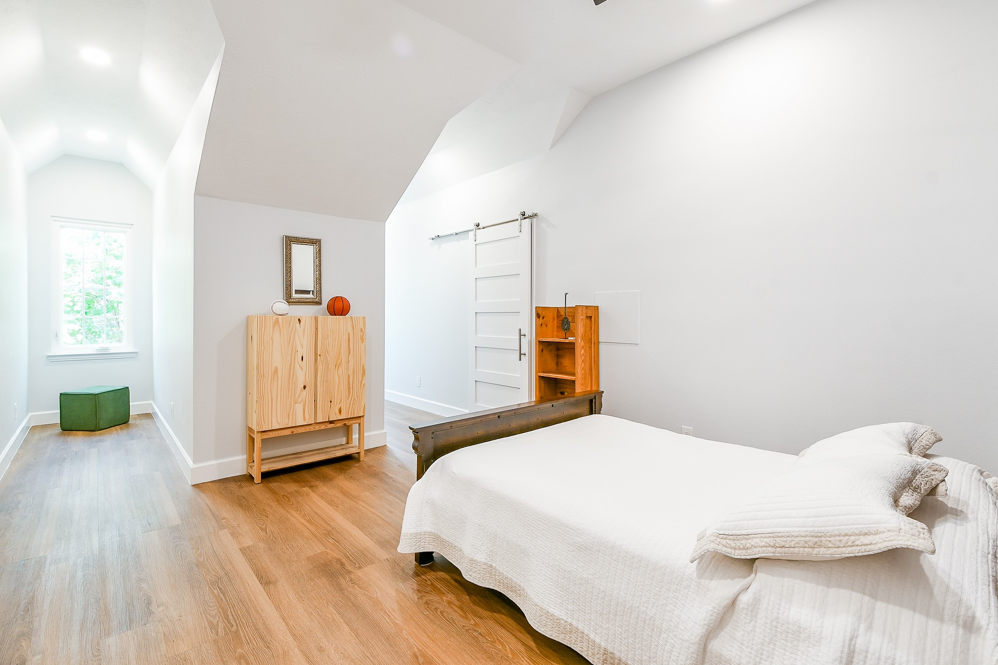 2442 Chimney Rock Road Houston, TX 77057 - Photo 46 of 50 a bedroom with a bed and wooden floor