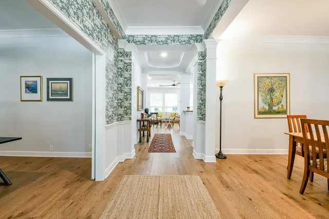 a view of a room with wooden floor windows and entryway