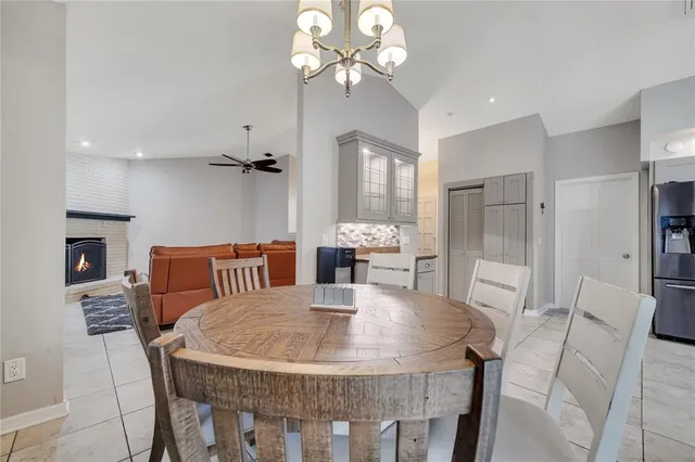 a dining room with furniture and window