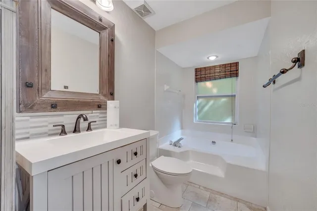 a bathroom with a sink and a bathtub