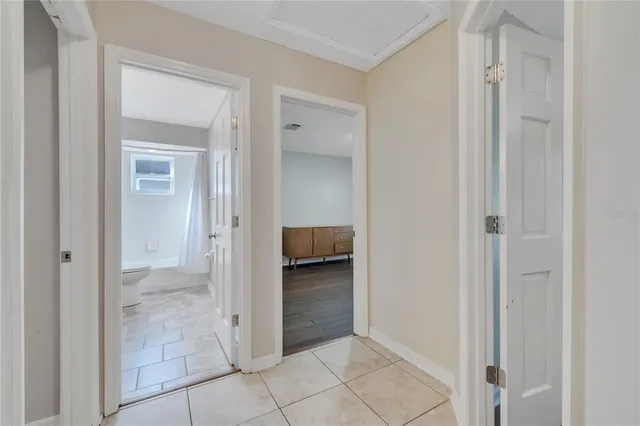 a view of a bedroom from a hallway