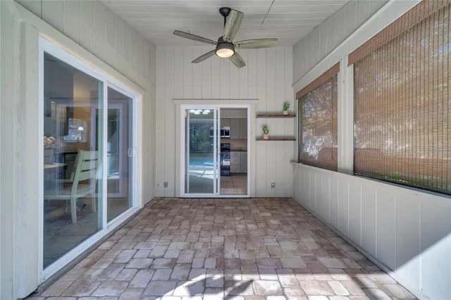 a very nice looking room with a large window and chandelier