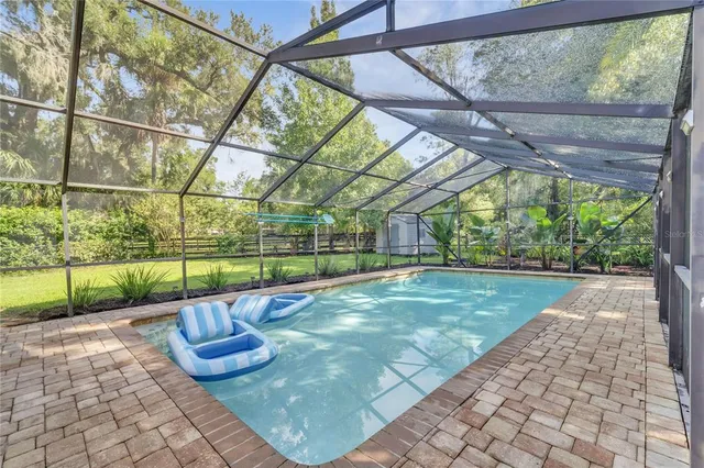 a view of a backyard with sitting area