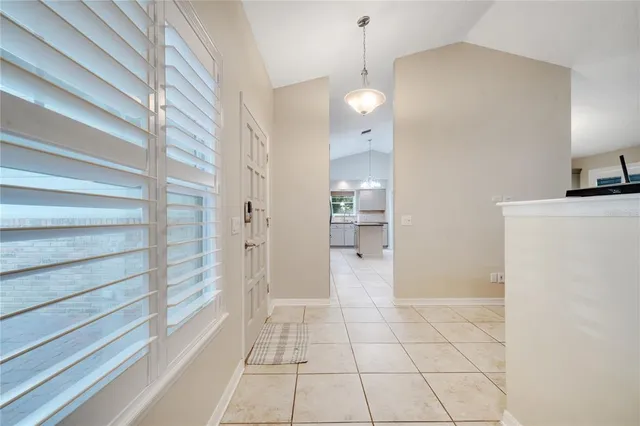 a view of an empty room and a windows