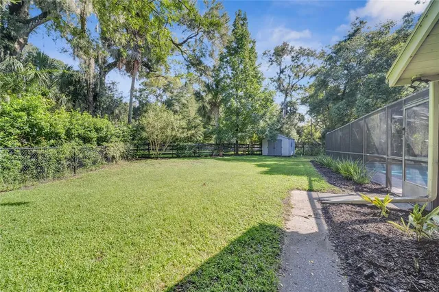 a view of a backyard with a small cabin