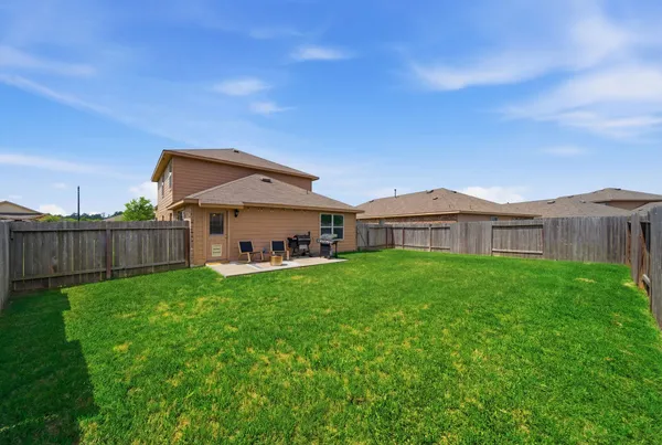 a view of backyard with slide