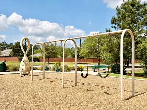 a park view with a bench in a park