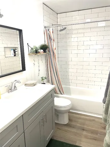 a bathroom with a sink a toilet and a bathtub