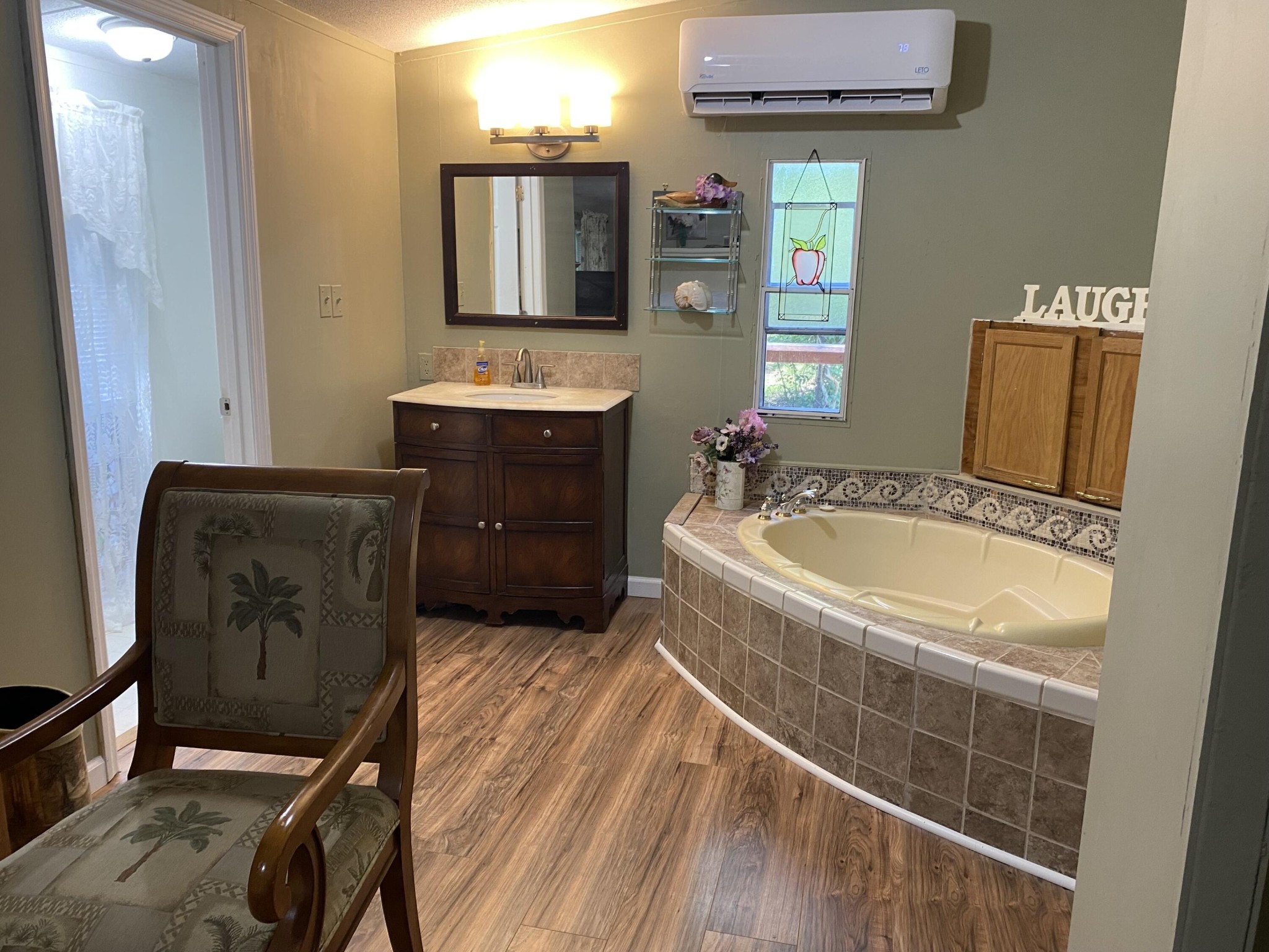 321 Pawnee Lane Decatur, TN 37322 - Photo 18 of 32 a bathroom with a tub sink and mirror