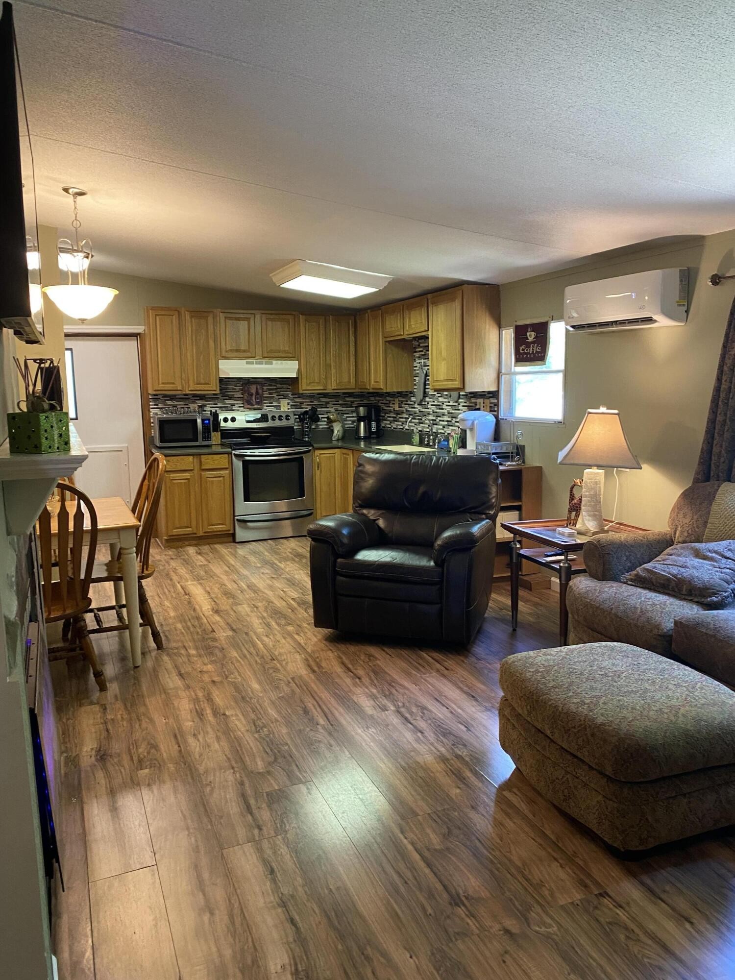 321 Pawnee Lane Decatur, TN 37322 - Photo 3 of 32 a living room with furniture and a wooden floor