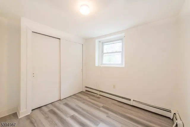 an empty room with a empty space and a window