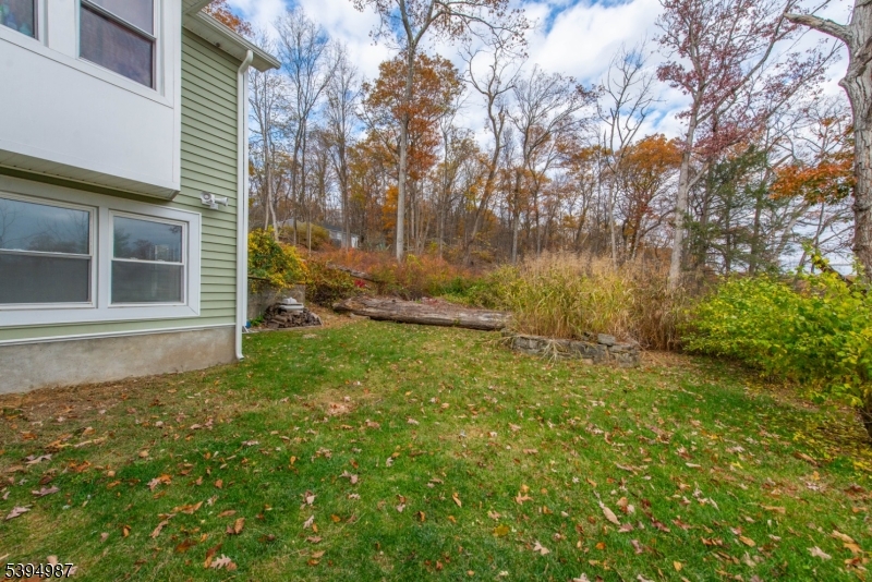 233 Lakeside Avenue Hopatcong, NJ 07821 - Photo 4 of 9 a backyard of a house with lots of green space